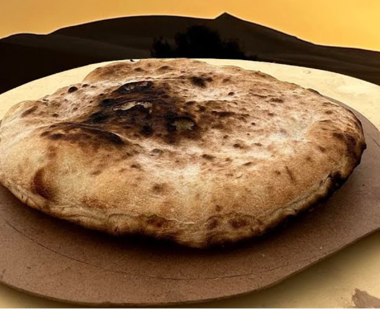 Discover Berber Pizza, also known as Medfouna